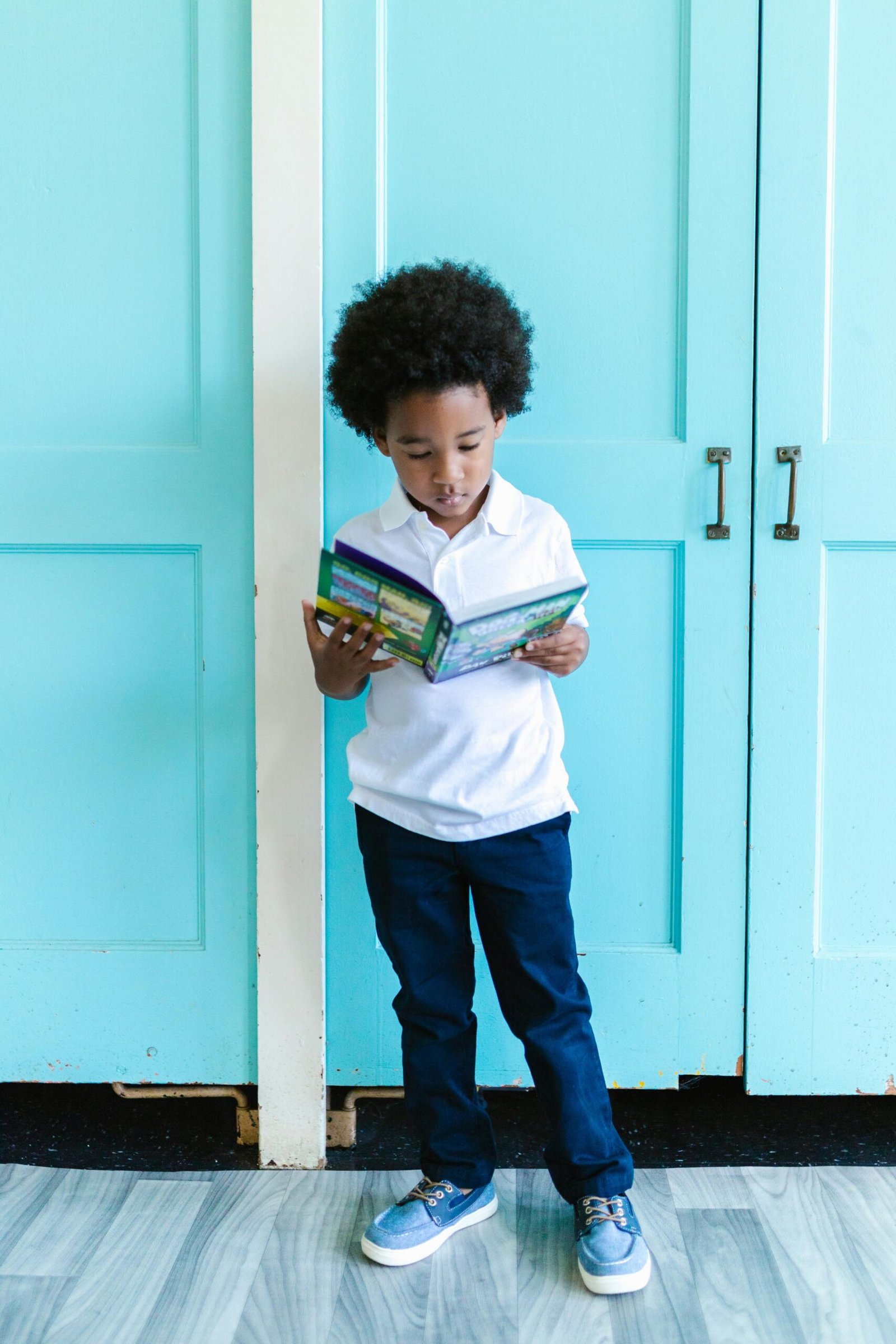 Kindergarten Student Reading a Book